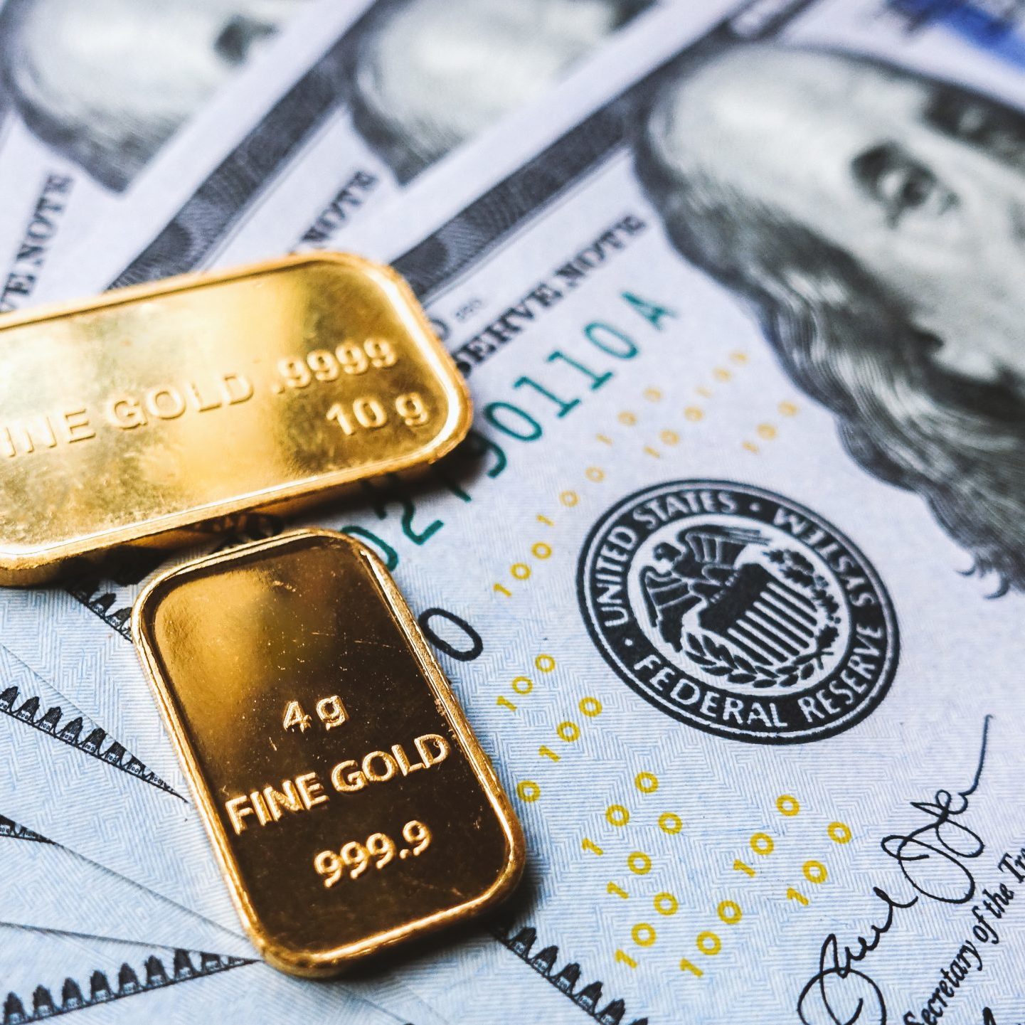 gold-bar-and-us-dollar-bills-2021-08-29-17-10-48-utc
